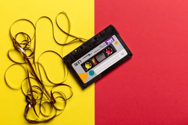 A cassette tape with its tape pulled out.