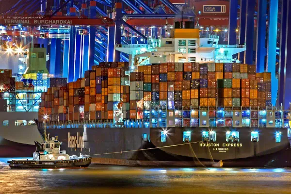 A container ship in a dockyard.